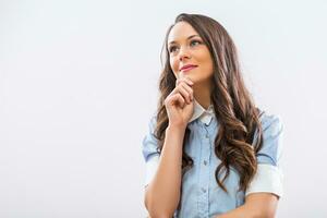 Beautiful businesswoman thinking and looking away photo