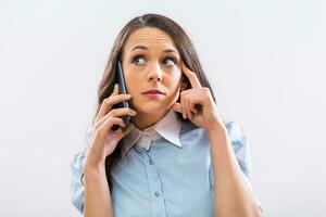 Image of pensive businesswoman using mobile phone on gray background photo