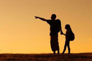 Father and daughter hiking photo