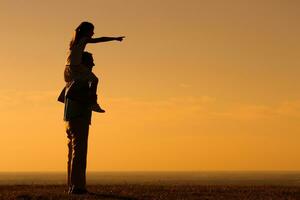 Happy father and daughter spending time in nature photo