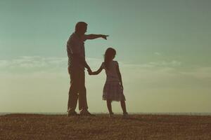 Happy father and daughter spending time in nature photo