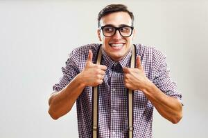 Nerdy man giving thumbs up photo