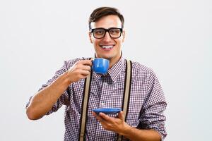 Nerdy man enjoys drinking coffee photo