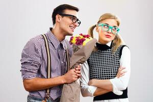 Nerdy man wants  that her nerdy girlfriend forgive him because of something photo
