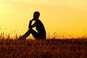 Silhouette of woman enjoying in the nature photo