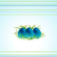 Blue Easter eggs and green spring grass photo