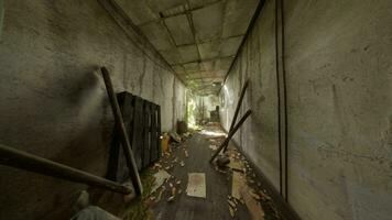 A deserted hallway filled with scattered debris and abandoned objects video