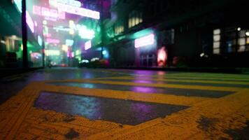 A city street at night with neon lights video