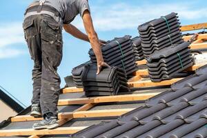 ceramic tiles on the roof, installation of a new roof by an expert photo