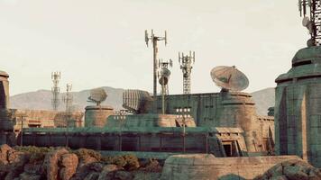 A fortified military base with an array of antennas on its roof video