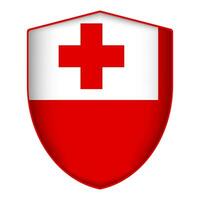 Tonga flag in shield shape. Vector illustration.