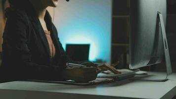 Young woman working in call centre, surrounded by colleagues video