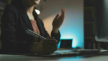 Young woman working in call centre, surrounded by colleagues video