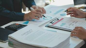 Business team meeting present, investor colleagues consultation and conference new strategy plan business and market growth on financial document graph report, Meeting and Talking. video