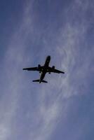 a large jetliner flying through the sky photo