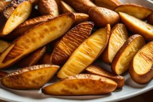 un plato de horneado patatas en un de madera mesa. generado por ai foto