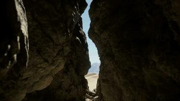 A narrow passage between two large rocks video