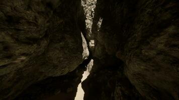 A narrow narrow path between two large rocks video