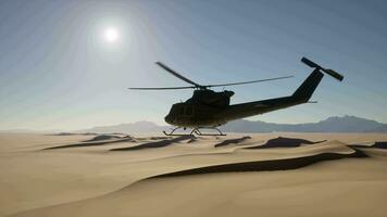 A helicopter is flying over a desert landscape video