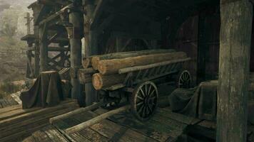 An ancient wooden building with a rustic wooden wagon video