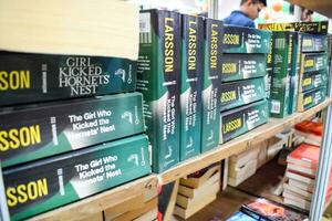 New Delhi, India, September 09 2023 - Variety of Books on shelf inside a book-stall at Delhi International Book Fair, Selection of books on display in Annual Book Fair. photo