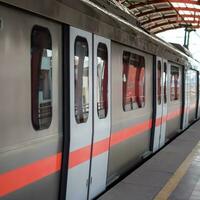 New Delhi India - October 09 2023 - Delhi Metro train arriving at Jhandewalan metro station in New Delhi, India, Asia, Public Metro departing from Jhandewalan station photo