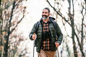 Image of man enjoys hiking in nature photo