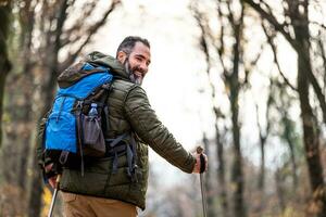 Image of man enjoys hiking in nature photo