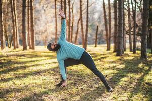 Man with beard enjoys exercising in nature photo