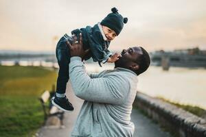 Happy father and his son enjoy spending time together outdoor photo