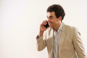 Image of excited businessman talking on the phone photo