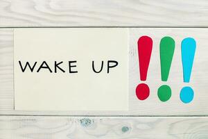 Photo of wake up text with exclamation marks,time for change concept.