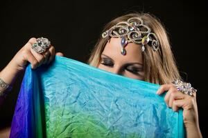 Image of beautiful belly dancer holding veil. photo