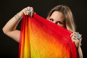 Image of beautiful belly dancer holding veil photo