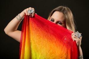 Image of beautiful belly dancer holding veil photo