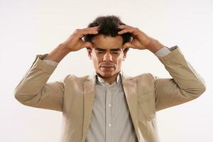 Image of tired  businessman having headache. photo