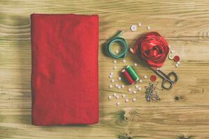 Sewing accessories on wooden table photo