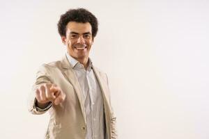 Portrait of happy businessman pointing photo