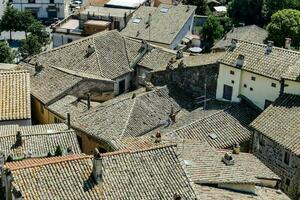 an aerial view of the roofs of an old town photo