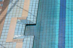 a view of the top of a building with blue glass photo