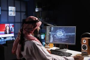 An Arabian engineer examining data and ensuring cybersecurity. With expertise in information technology and programming, he develops software for machine learning and quantum computing. photo