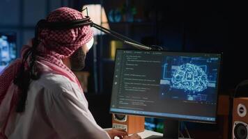 Experienced Arab developer programming scripts on computer screen, employing AI machine learning, manipulating lines of code for artificial intelligence applications computing video