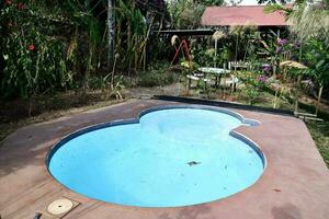 a small pool in the backyard of a house photo