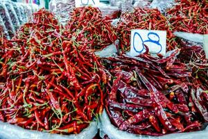 chili peppers for sale at a market photo