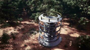 A futuristic glass greenhouse tower in the middle of a desert landscape video