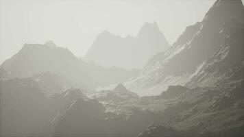 A misty mountain range engulfed in a mysterious fog video