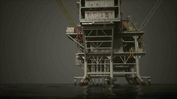 A towering clock on an offshore oil rig amidst the vast expanse of the ocean video