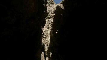 A narrow passage between two large rocks video