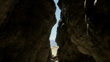 A narrow passage between two large rocks video