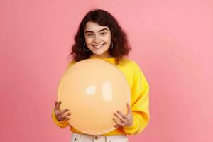 Positive girl holding bubble balloon pink background. Generate Ai photo